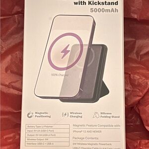 Pink magnetic power bank with silicon kick stand. 500 mah